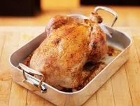 עוף שלם מתובל עם אורז